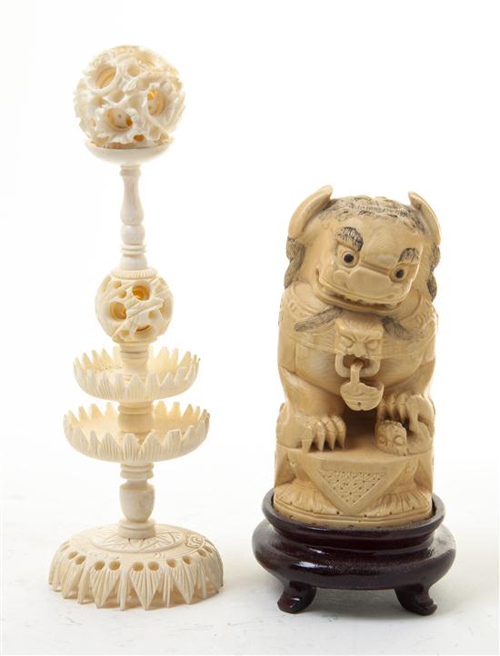 * A Carved and Tea Stained Ivory Fu
