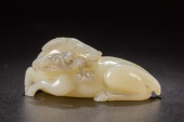 A CARVED ARCHAIC JADE BEAST<br