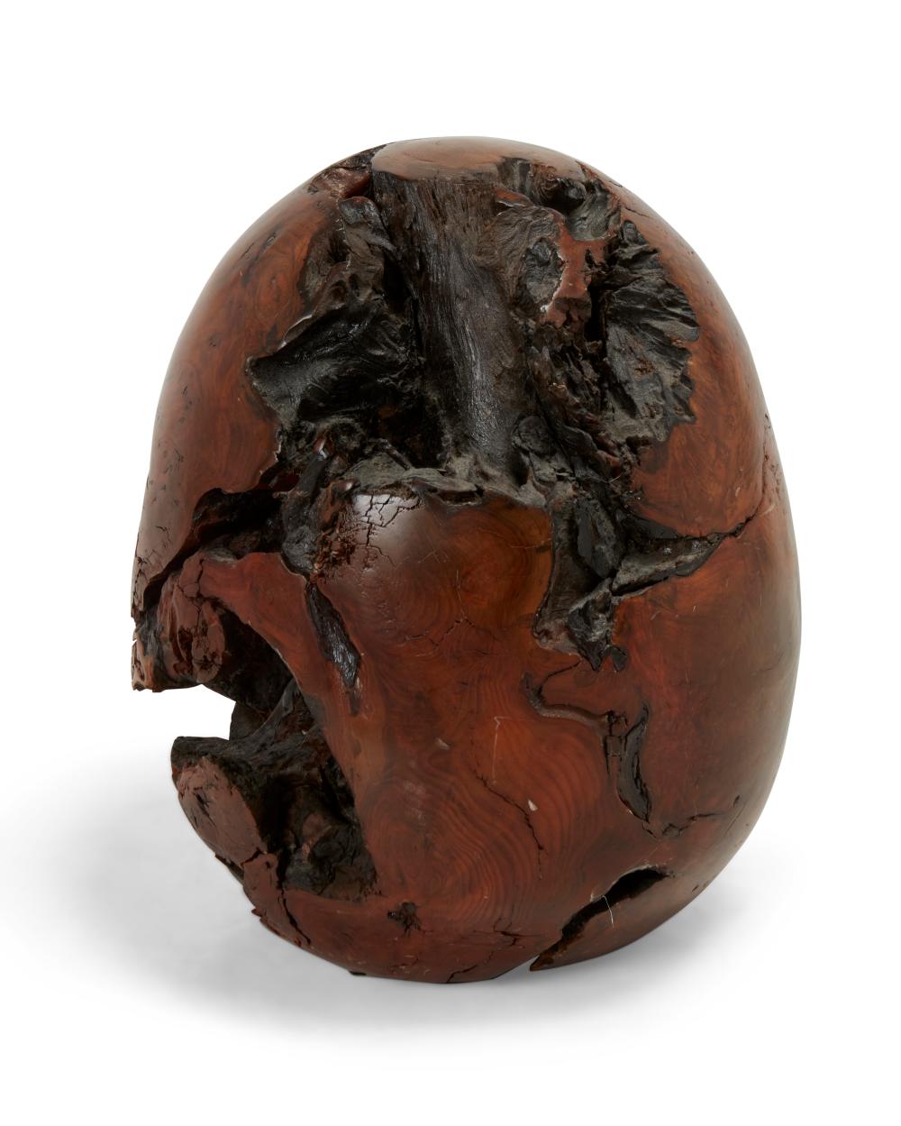 A CARVED BURLWOOD EGG SCULPTUREA