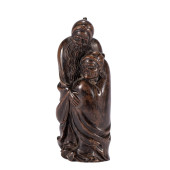 A CARVED CHENXIANG FIGURE ORNA