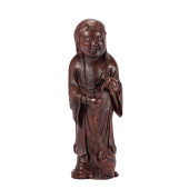 A CARVED CHENXIANG FIGURE ORNA