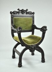 A Carved Devil Motif Arm Chair
