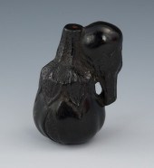 A Carved Ebony Netsuke of Gour