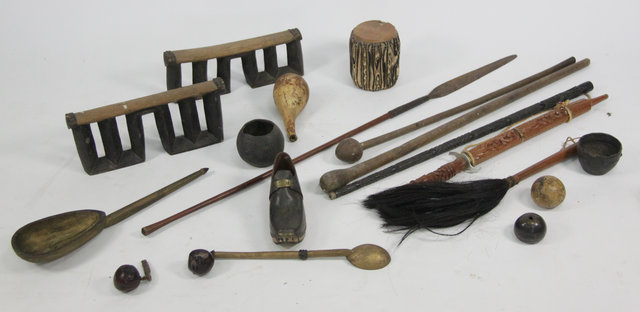 A carved ebony tribal stick various