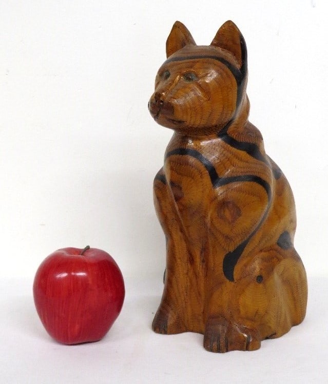 A CARVED FOLK ART WOODEN CAT SIGNED