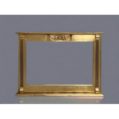 A CARVED GILT-WOOD OVERMANTLE
