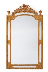 A CARVED GILTWOOD WALL MIRRORA