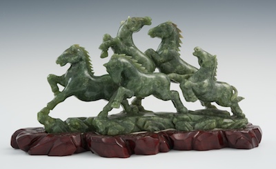 A Carved Green Nephrite Figural