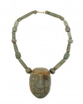 A CARVED GREENSTONE MASK NECKL