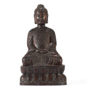 A CARVED HARDWOOD SEATED FIGUR