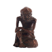 A CARVED HUANGHUALI ARHAT<br>D