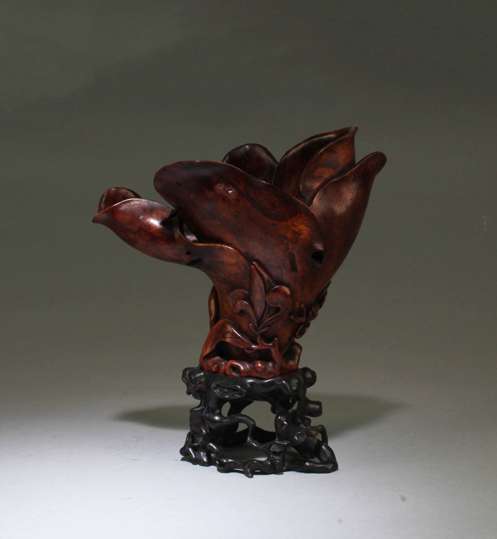A CARVED HUANGHUALI FLOWER-SHAPED