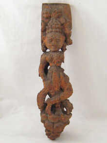 A carved Indian wooden figure of