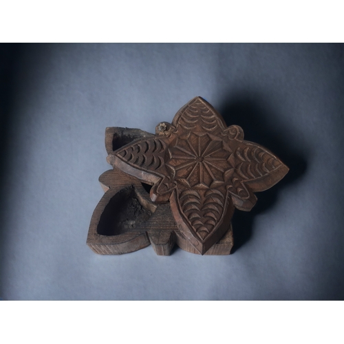 A CARVED INDIAN WOODEN SPICE BOX.
