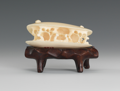 A Carved Ivory Anabori Netsuke In