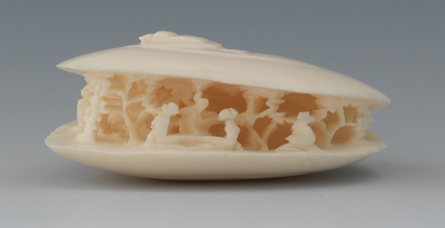 A Carved Ivory Anabori Netsuke In