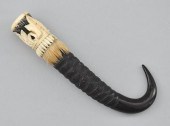 A Carved Ivory and Horn Talon