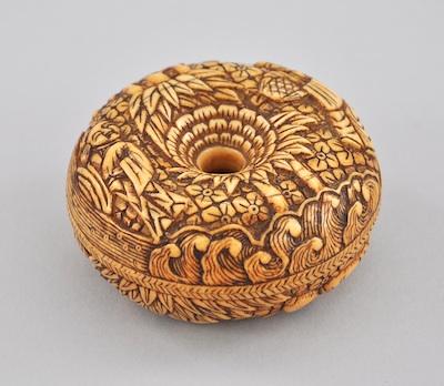 A Carved Ivory Box Round form
