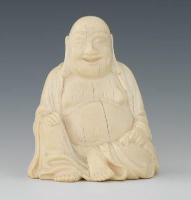 A Carved Ivory Buddha Figurine