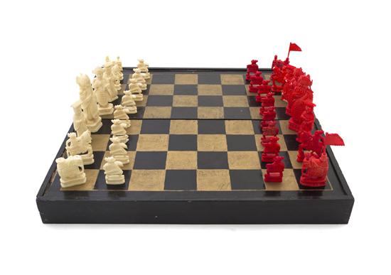 A Carved Ivory Chess Set half of