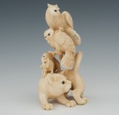 A Carved Ivory Figural Group o