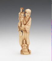 A Carved Ivory Figural of a Pu