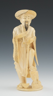 A Carved Ivory Figure of a Farmer
