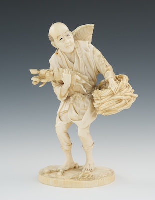 A Carved Ivory Figure of a Farmer