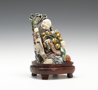 A Carved Ivory Figure of the God of