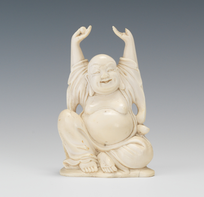 A Carved Ivory Figure of Buddha