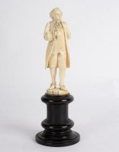A carved ivory figure of Louis