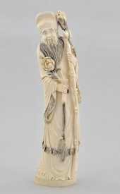 A Carved Ivory Figure of a Sch