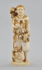 A Carved Ivory Figure of A Man