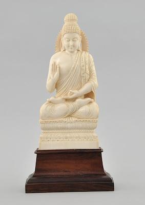 A Carved Ivory Figure of Seated