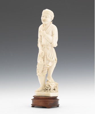 A Carved Ivory Figurine of a
