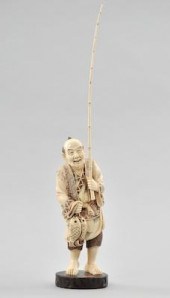A Carved Ivory Figurine of a F