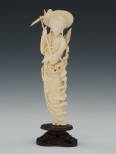 A Carved Ivory Gardener Standi