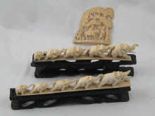 A carved ivory group of elephants