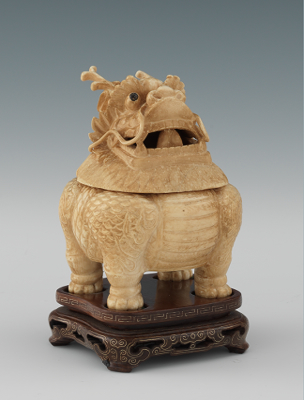 A Carved Ivory Kylin Container on