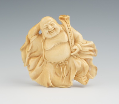 A Carved Ivory Laughing Buddha