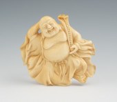 A Carved Ivory Laughing Buddha