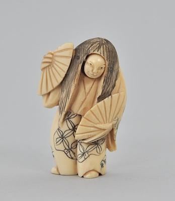 A Carved Ivory Netsuke Carved