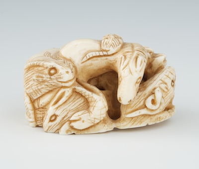 A Carved Ivory Netsuke of Animals