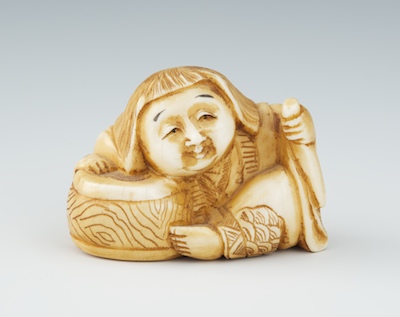 A Carved Ivory Netsuke of a