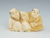A Carved Ivory Netsuke of Two