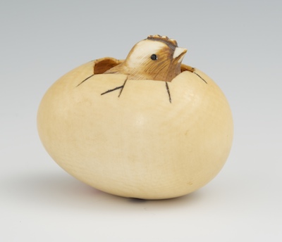 A Carved Ivory Netsuke of a