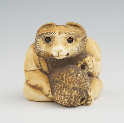 A Carved Ivory Netsuke of a