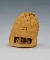 A Carved Ivory Netsuke of a Ba