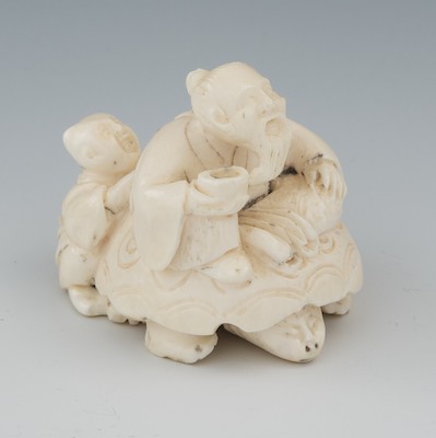 A Carved Ivory Netsuke of a Man