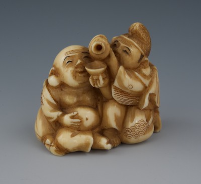 A Carved Ivory Netsuke of a Two Men